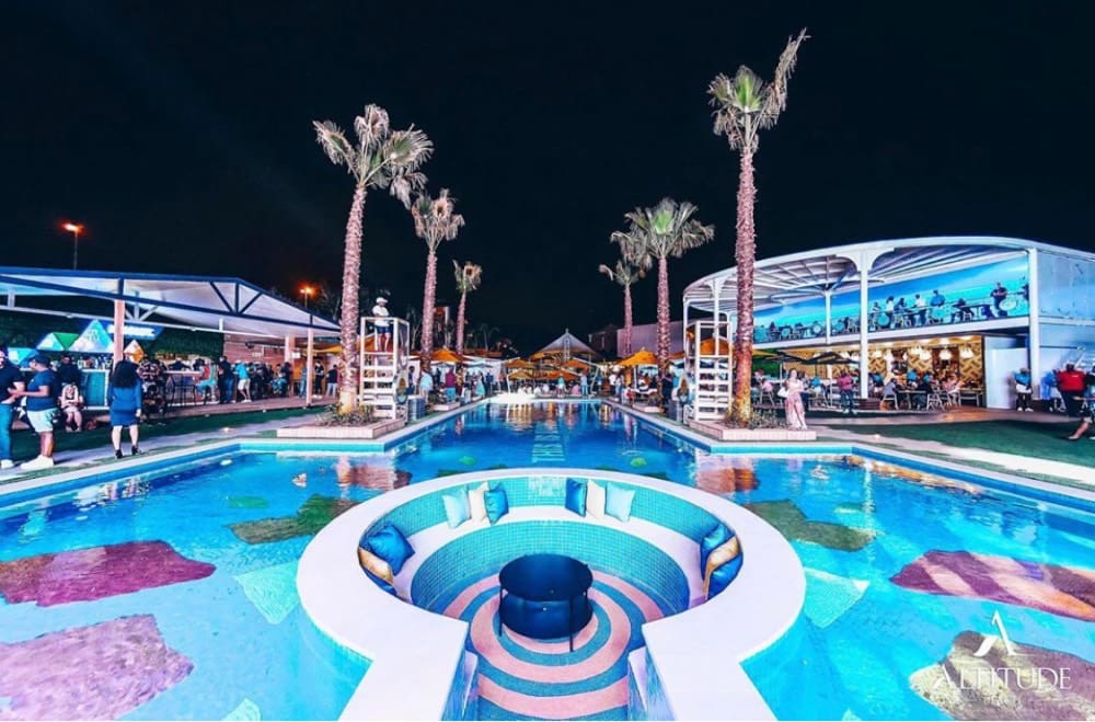 altitude beach at nights with pool view