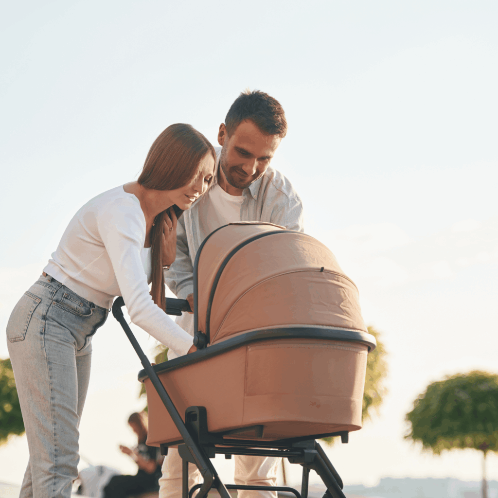 parents with their baby in a pram