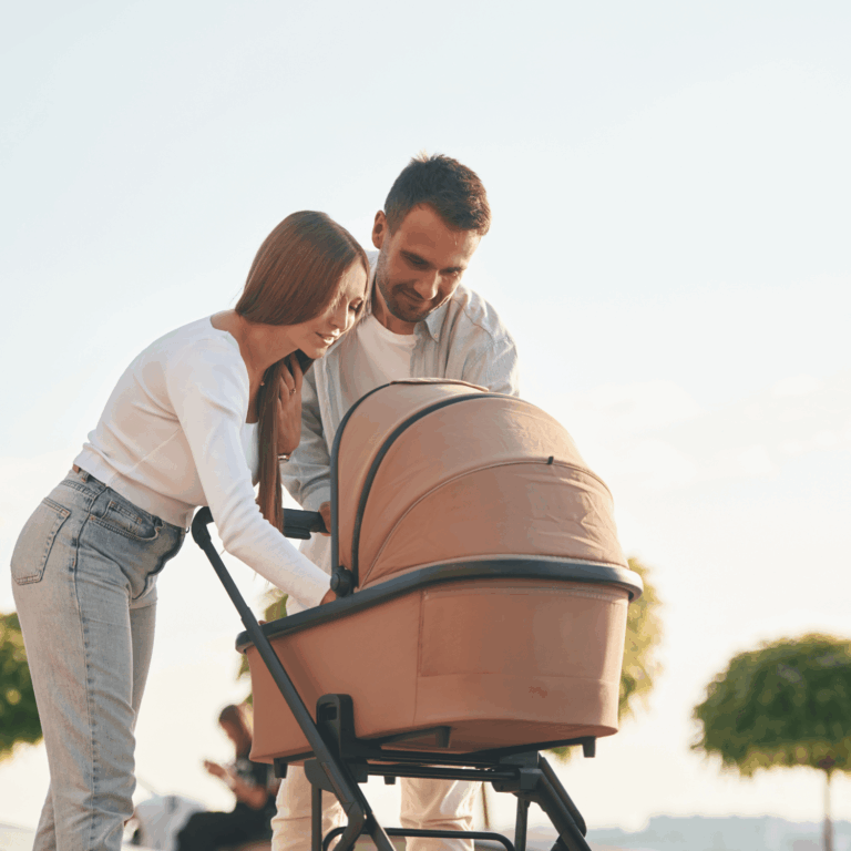 parents with their baby in a pram