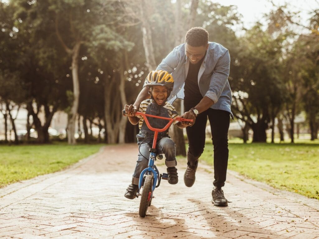 dad and son riding a bike hello joburg