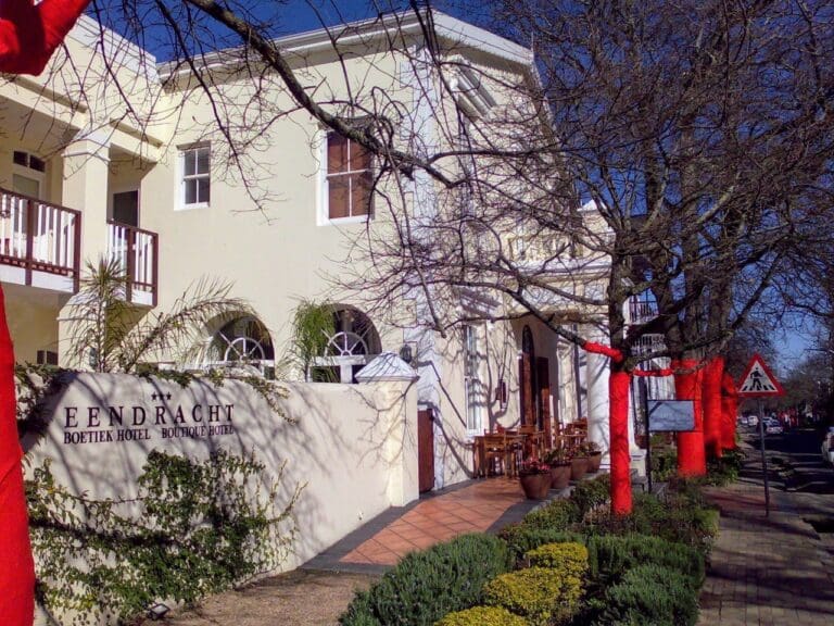 view of hotel front entrance with trees