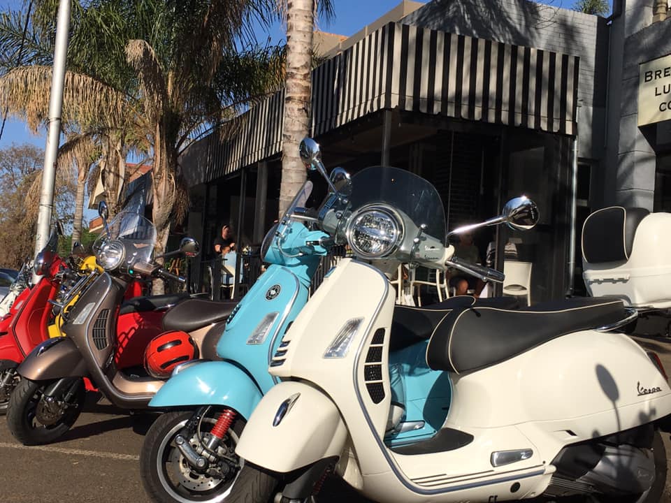 exterior view of Fat Zebra with Vespas