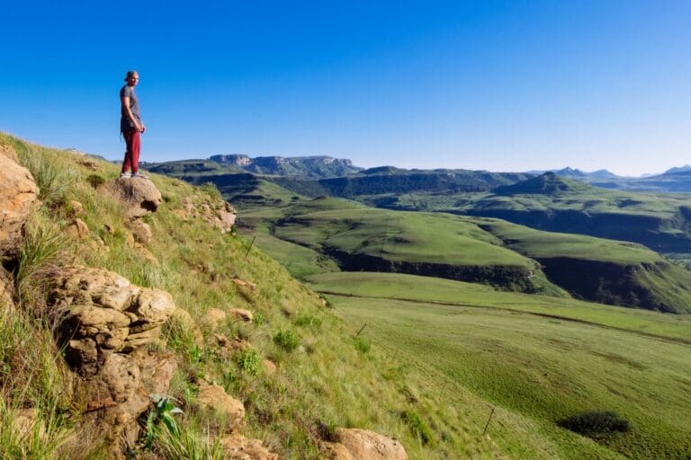 man overlooking the valley on a hike