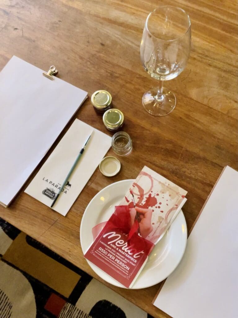 image of wine glass and restaurant menu on table