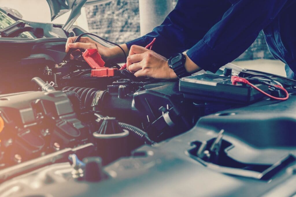 Man checking battery voltage