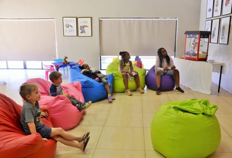 image of kids watching tv in play room