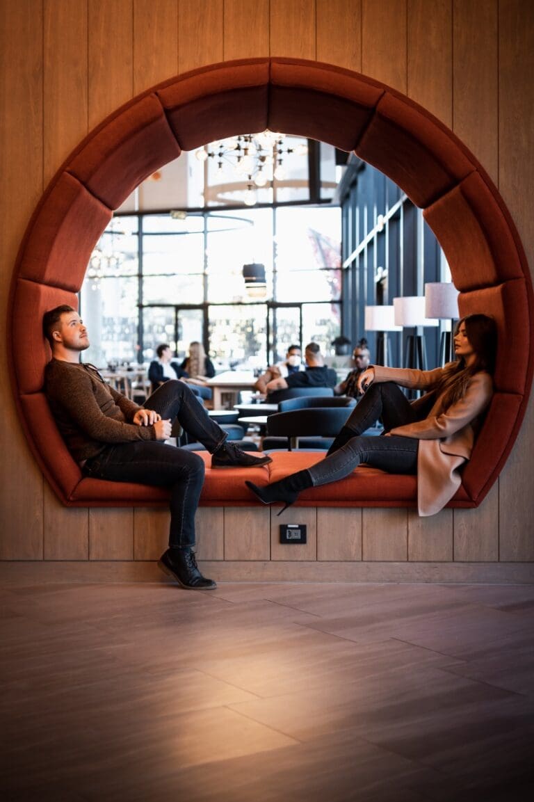 two people sitting inside a window