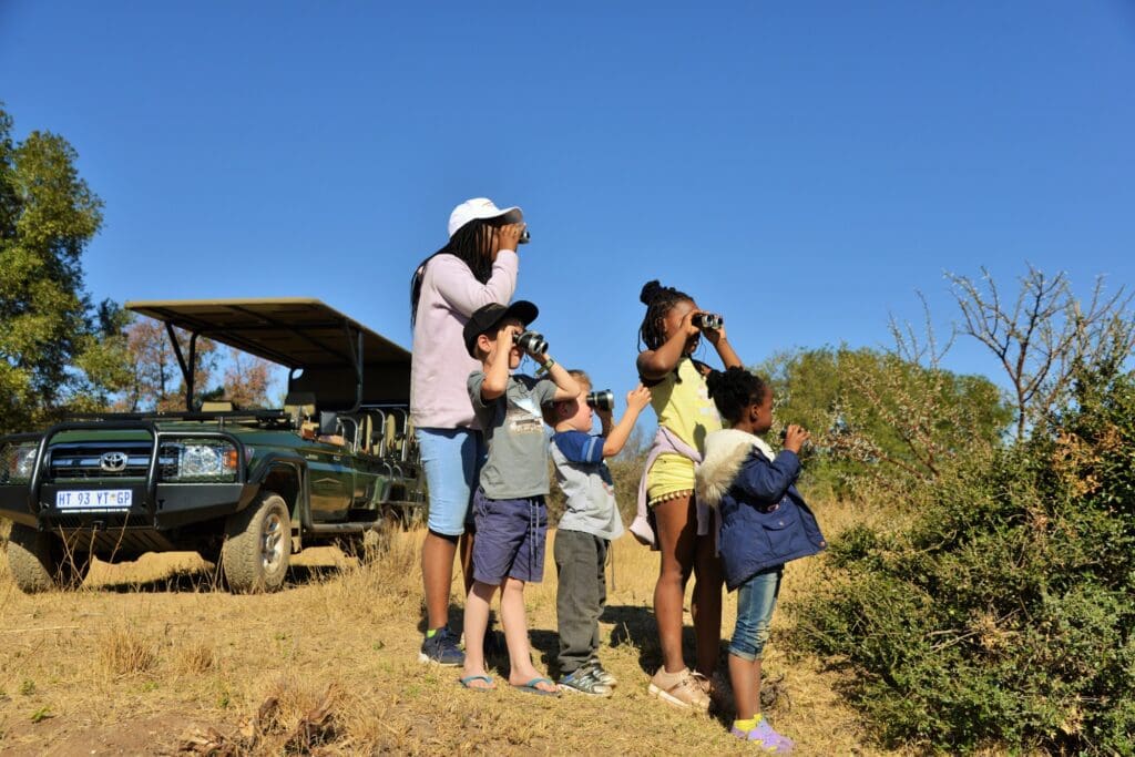 kids looking for animals at safari plains mabula