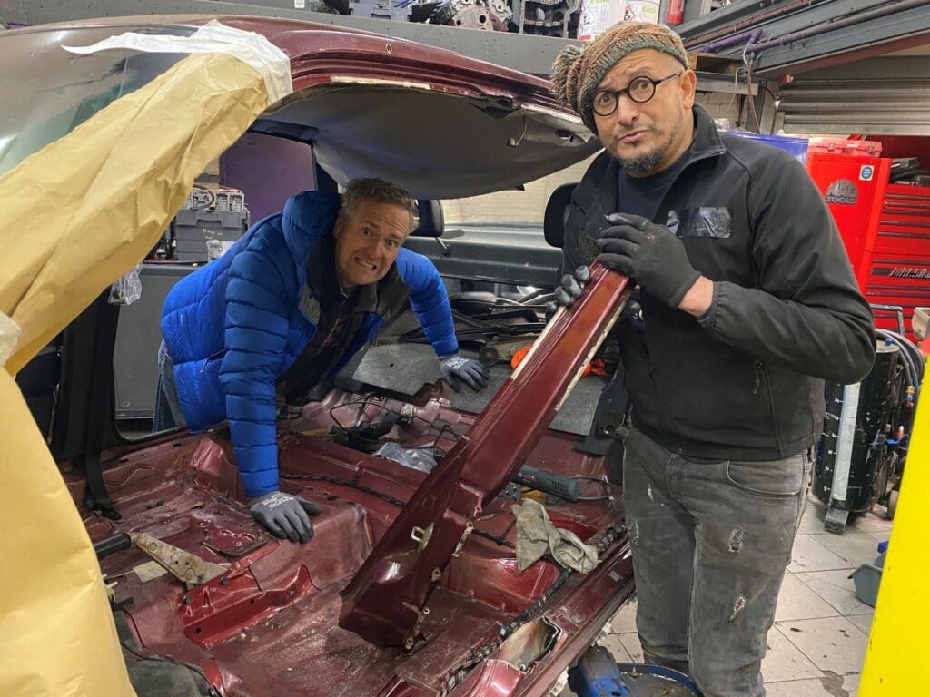 Tim Shaw and Fuzz Townshend posing with the Vauxhall Cavalier. (National Geographic)