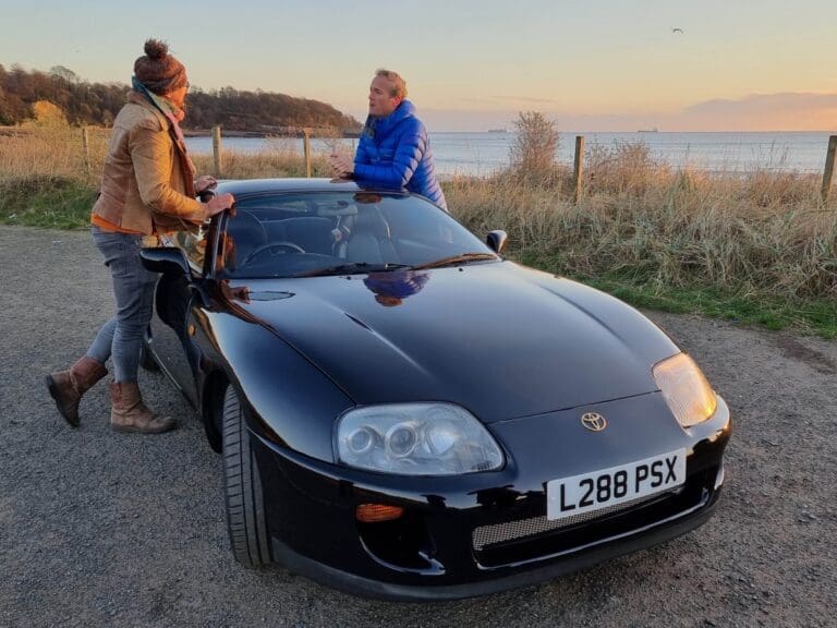 Fuzz Townshend and Tim Shaw leaning over the Toyota. (National Geographic)