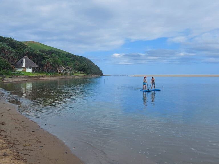 Two holiday makers on SUP Board at Umngazi