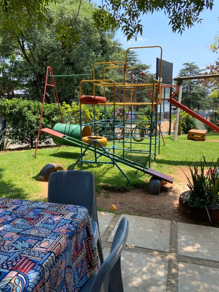 Outdoor play area with jungle gym