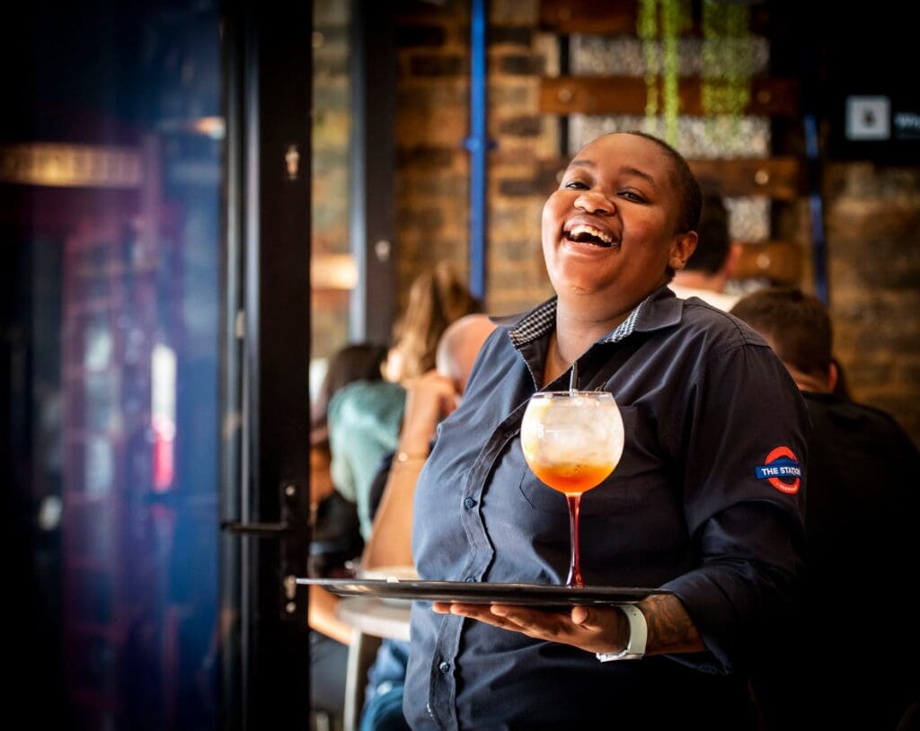 Smiling waiter at The Station Parkhurst