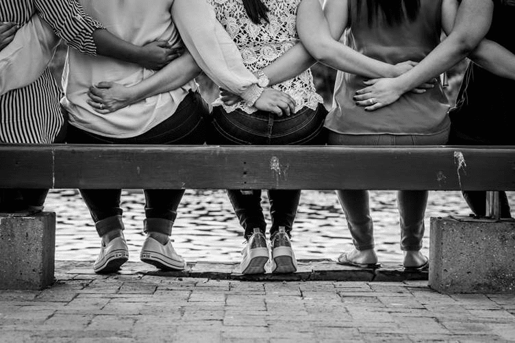 Women sitting on park bench