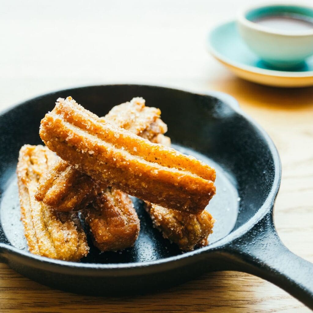 Sweet fried Churros donut with chocolate sauce