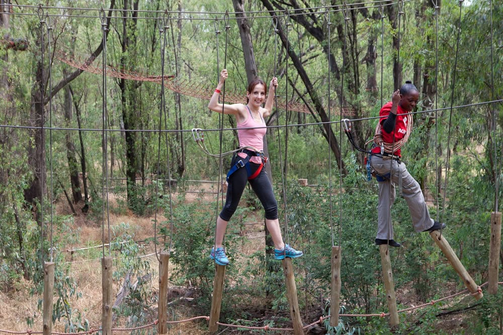 Girl climbing at Acrobranch