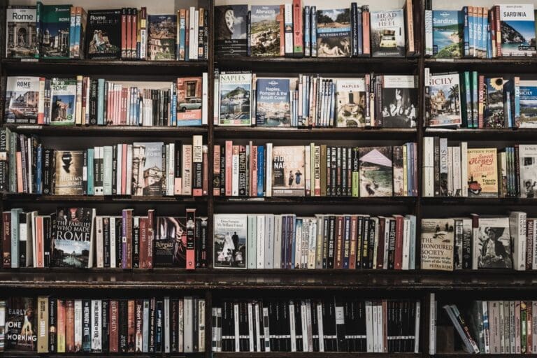 Bookshelf with loads of books unsplash