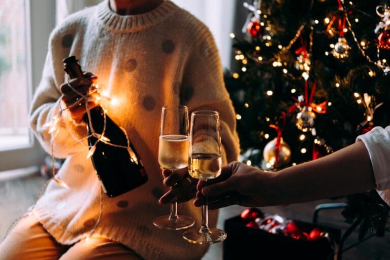 Christmas tree with people and bubbly