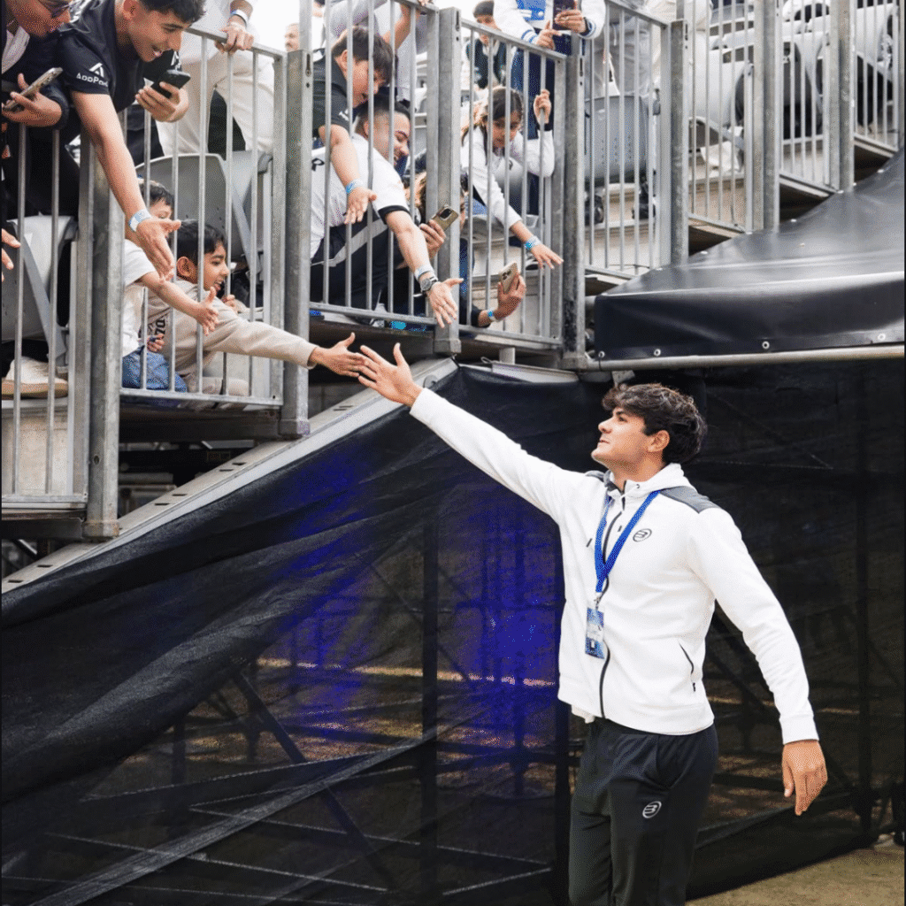 Greeting fans in the VIP stands at the SA Invitational