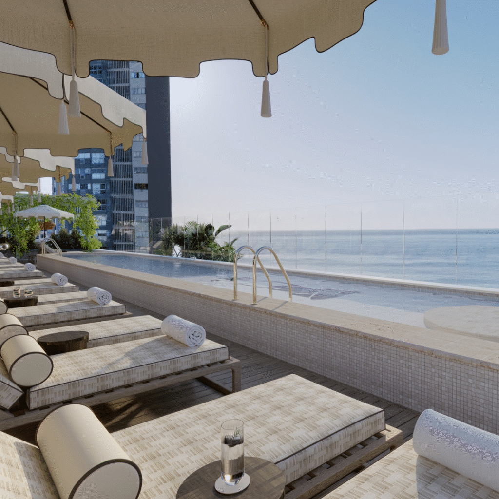 Lounges overlooking an infinity pool and the ocean from The Cole