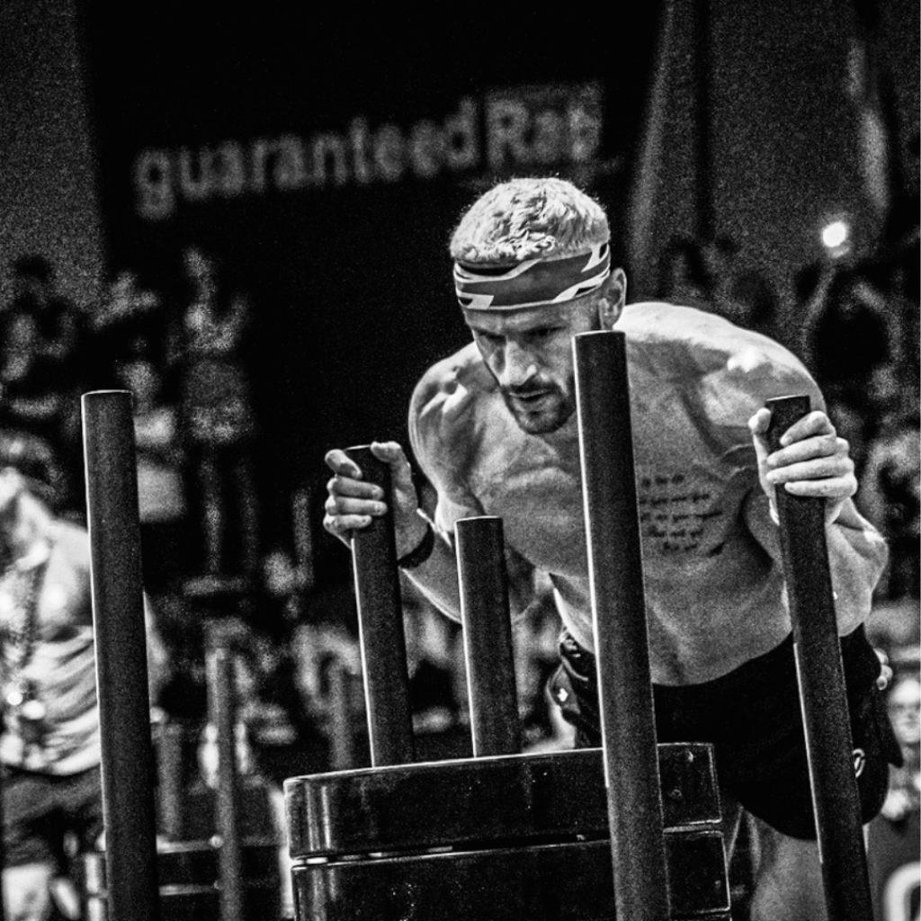 Man pushing sled at Hyrox event