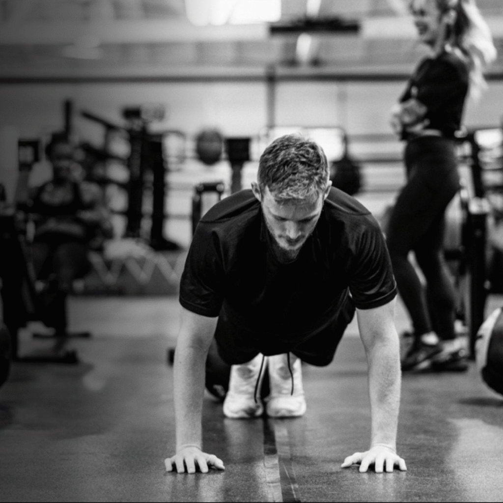 Man doing burpees as part of Hyrox race