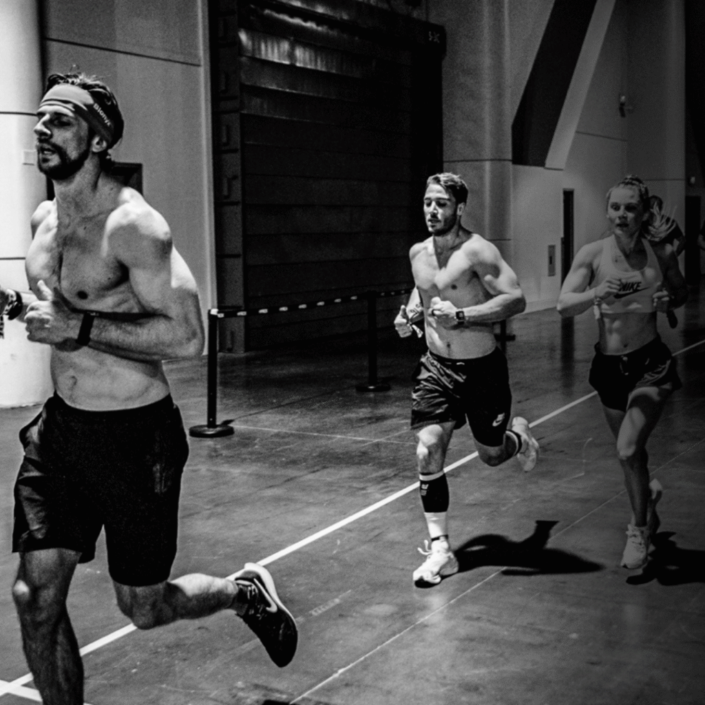 Men running at Hyrox event