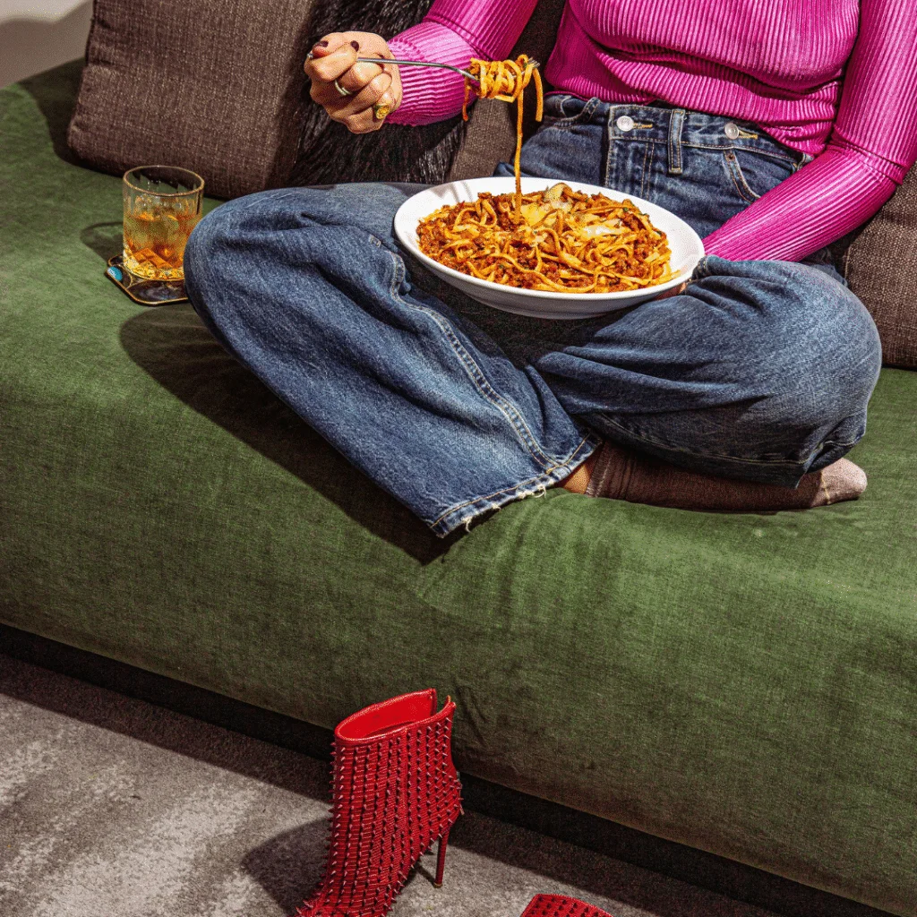 Lady eating pasta at The Rockefeller