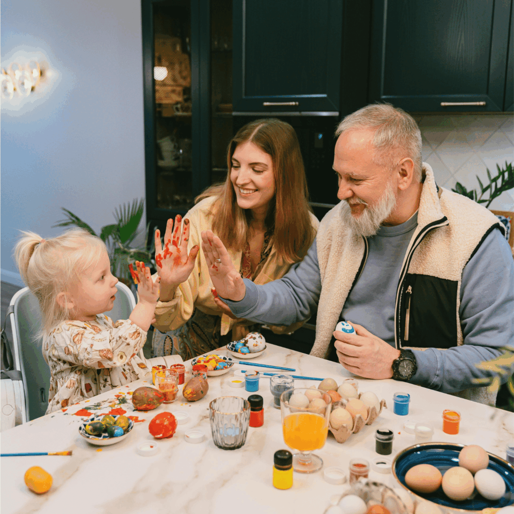 a family doing arts and crafts with a young child