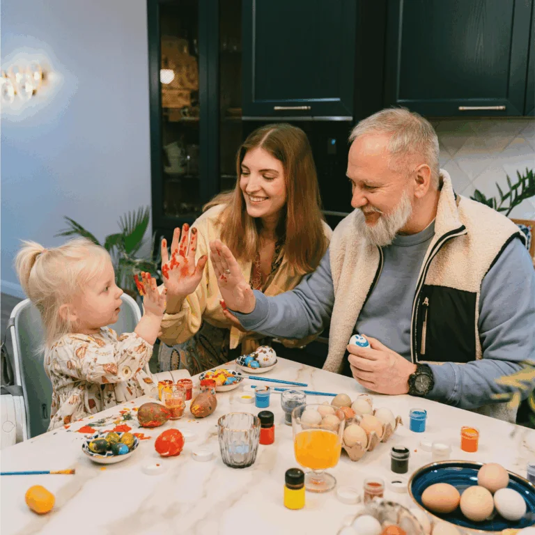a family doing arts and crafts with a young child