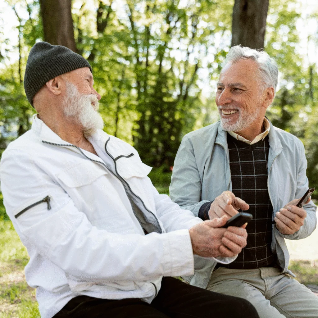 Older men laughing together in nature