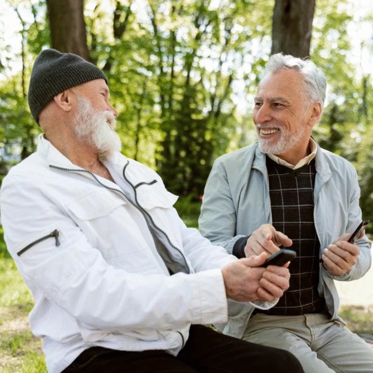 Older men laughing together in nature