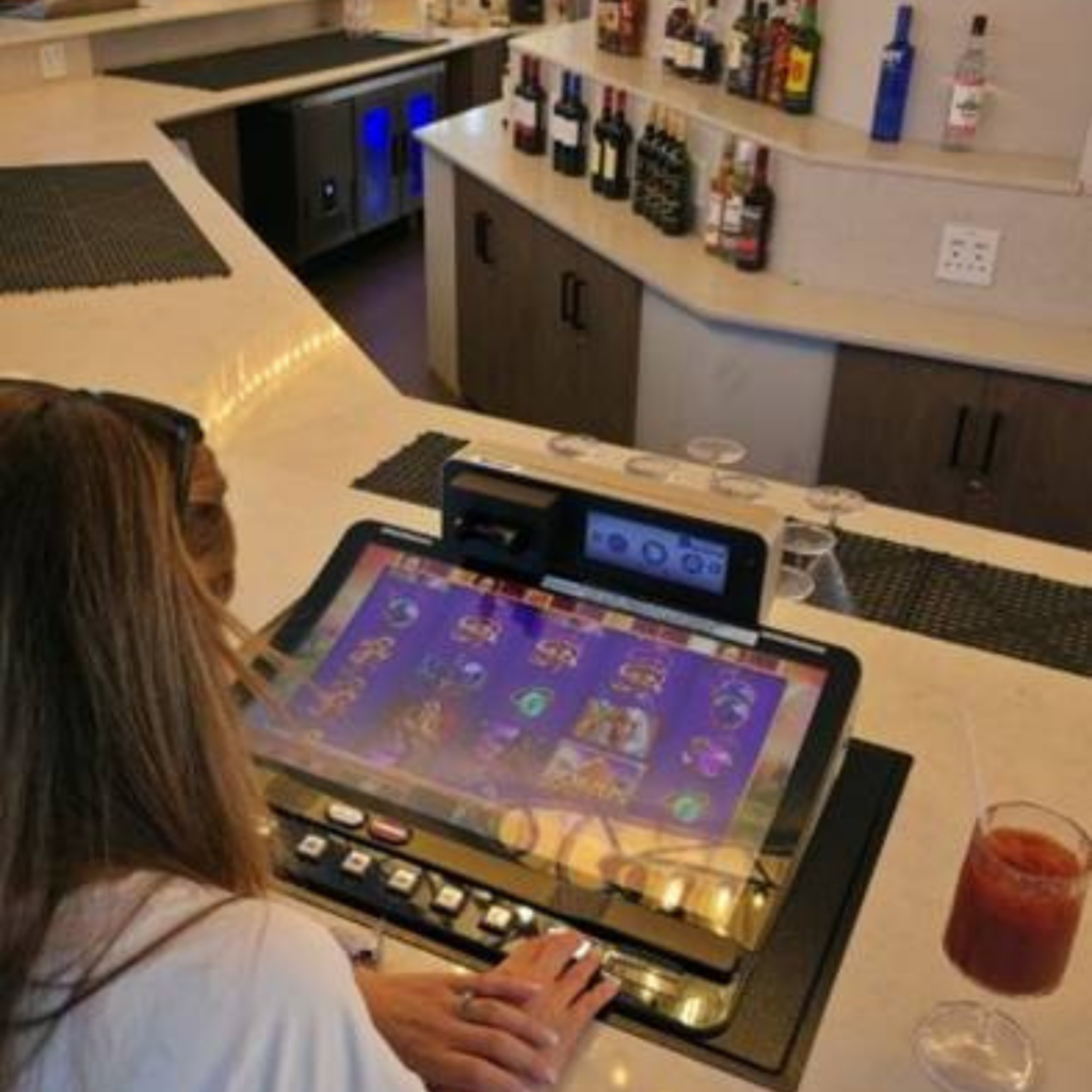 Lady playing Poolside Slots at Sun City Resort