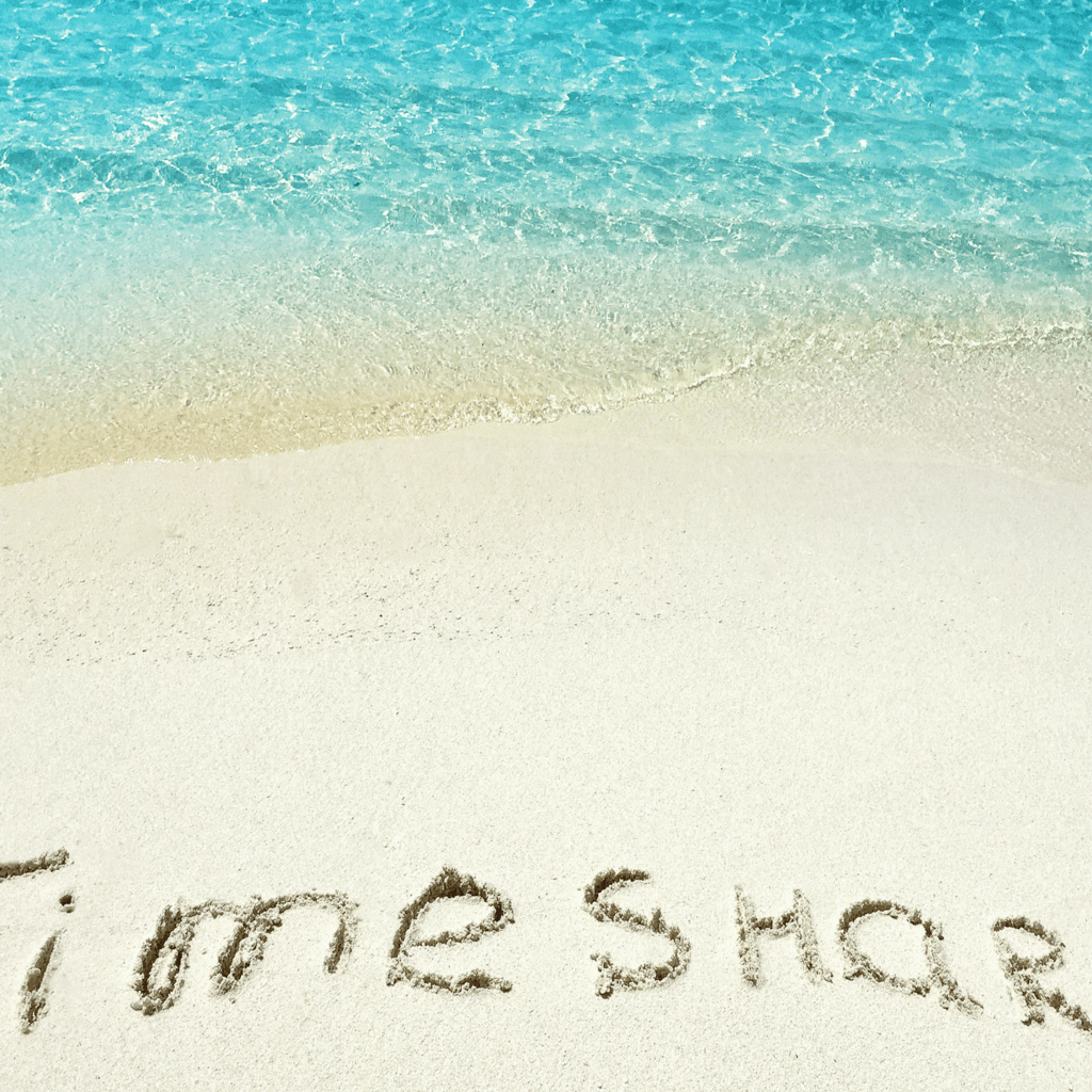 Timeshare written on the sand on a beach