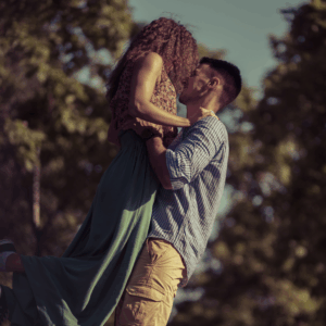 man twirling a woman around