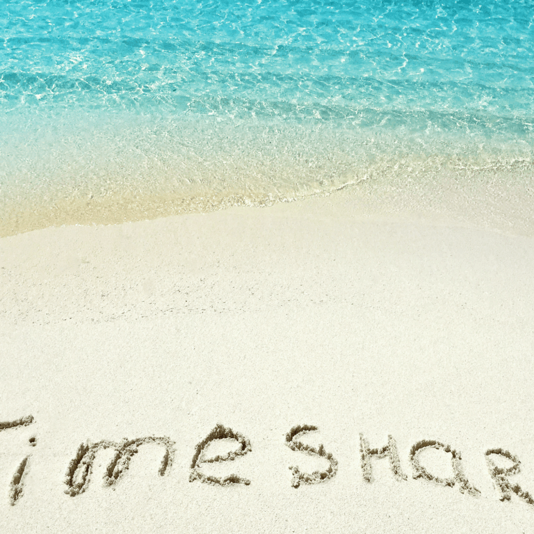 Timeshare written on the sand on a beach
