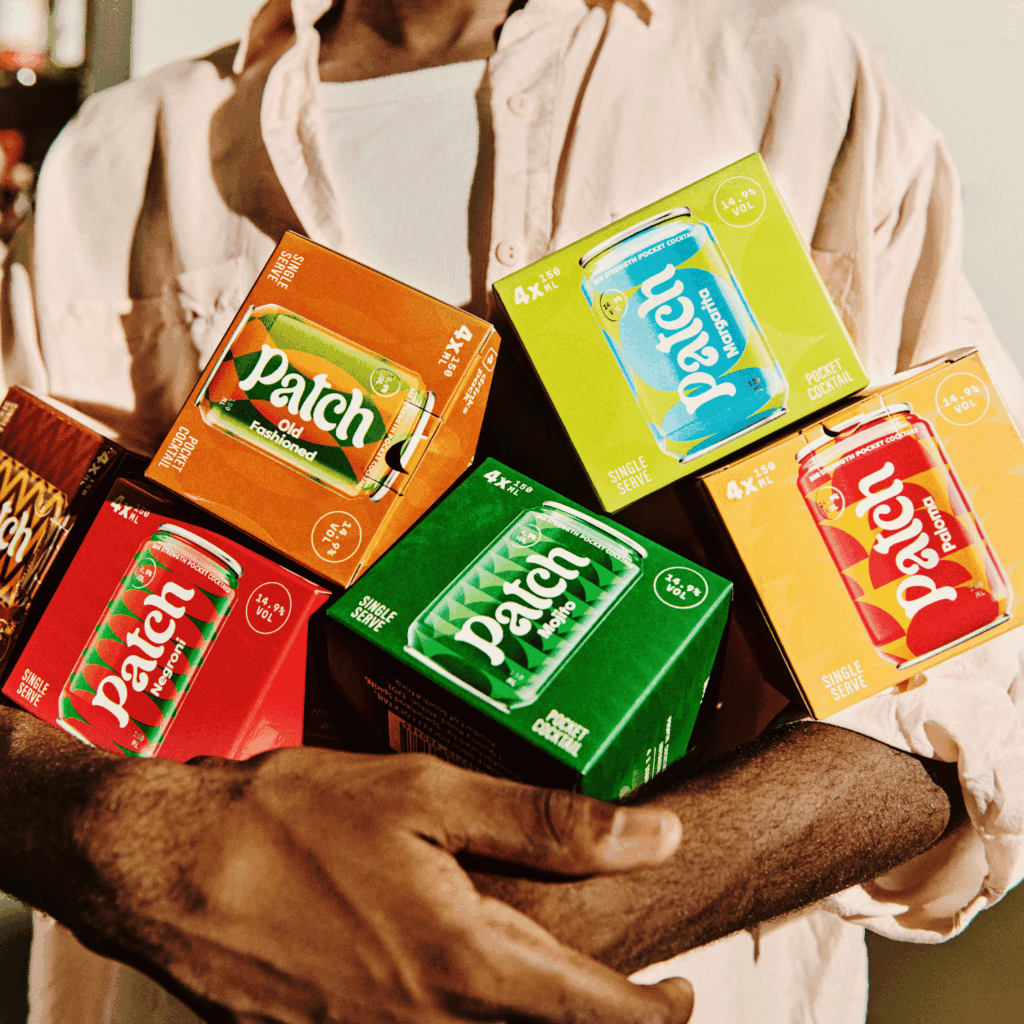 Man holding multiple Patch Cocktails in his hands