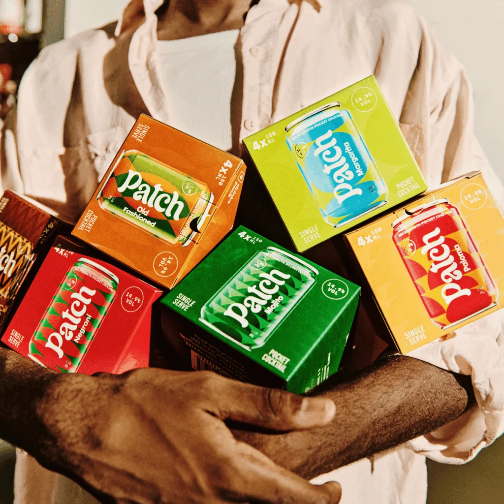 Man holding multiple Patch Cocktails in his hands