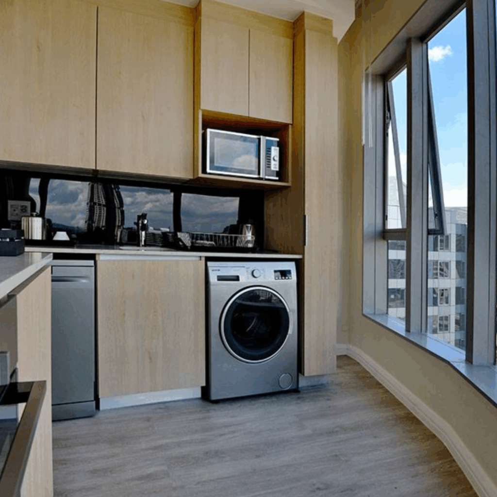 @Sandton Hotel Junior Suite Kitchenette with washing machine and microwave