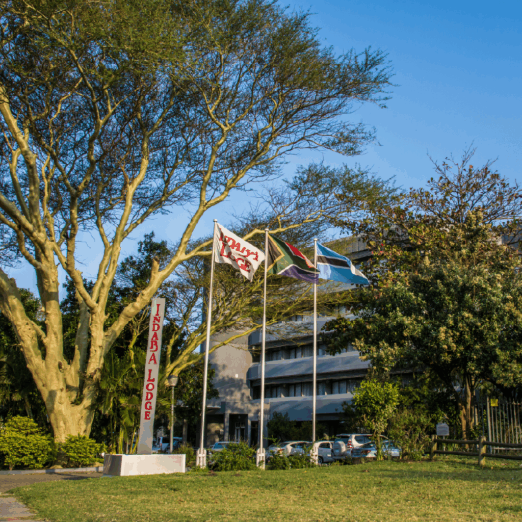 Indaba Lodge exterior with flags