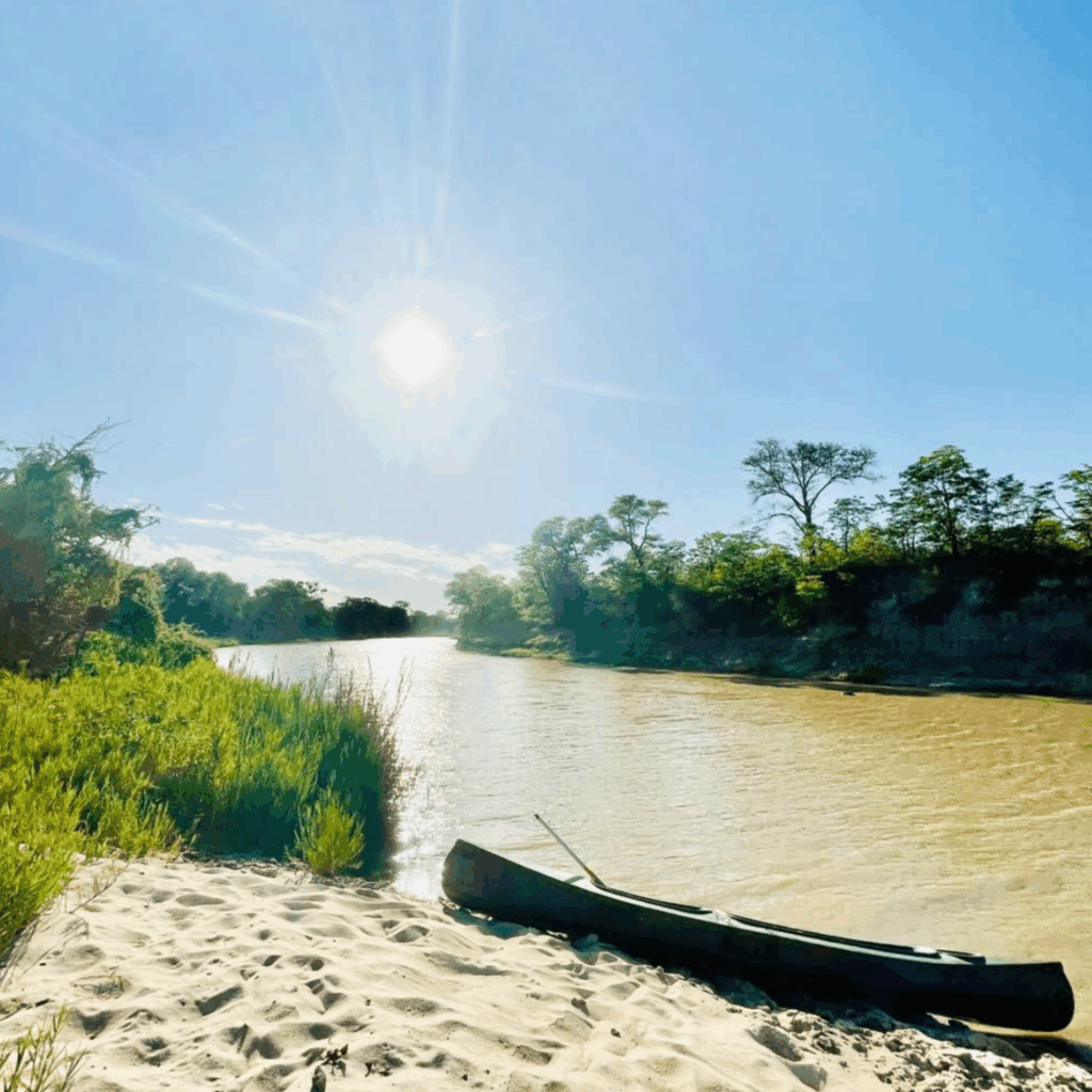 Nata Lodge paddling on river