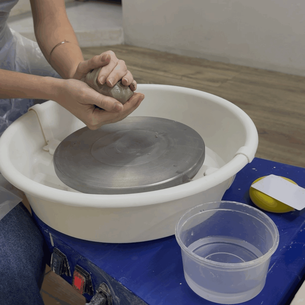 learning about pottery on the wheel