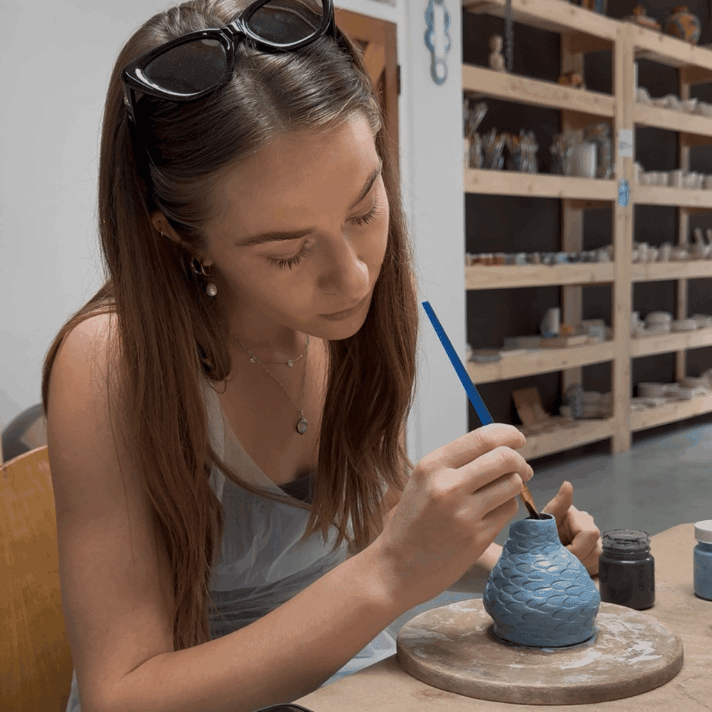 woman ceramic and pottery painting