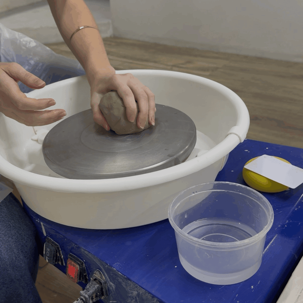 learning about pottery on the wheel