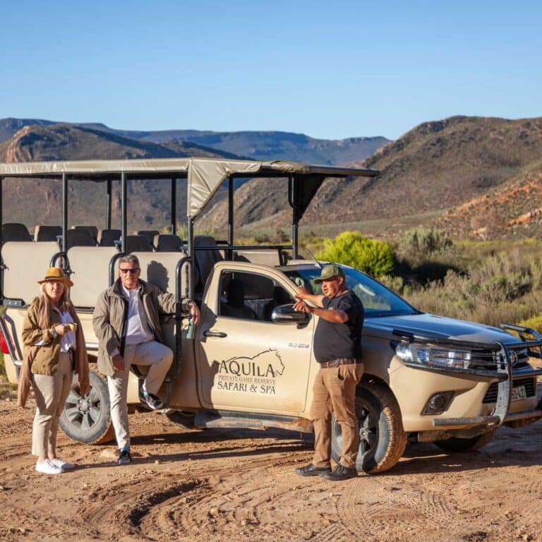 Two people on Safari at Aquila Private Game Reserve & Spa