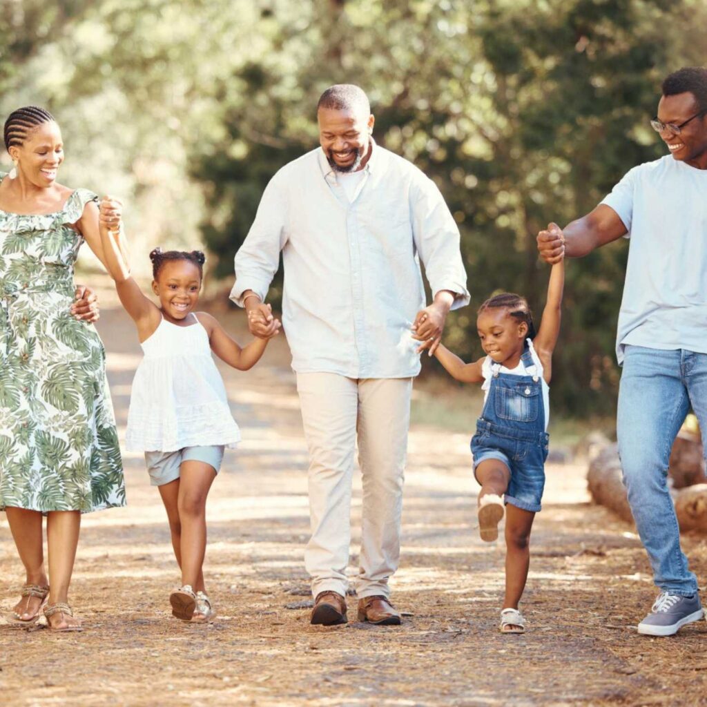 Happy family walking in the park