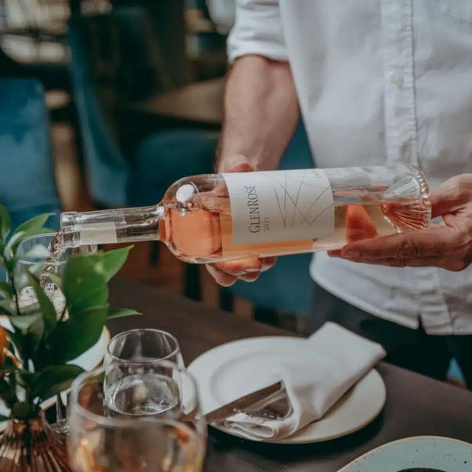 Wine being poured at ROAR Bistro & Bar.