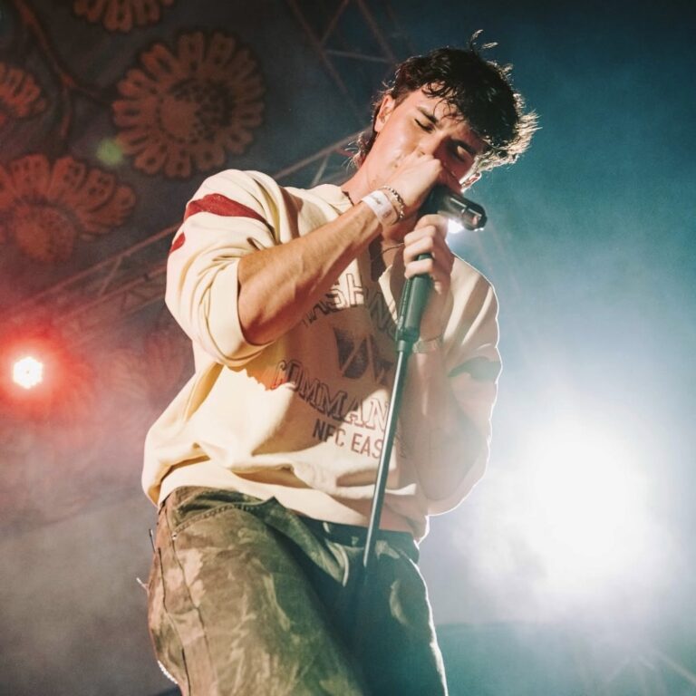Ben Rodrigues performing with a microphone