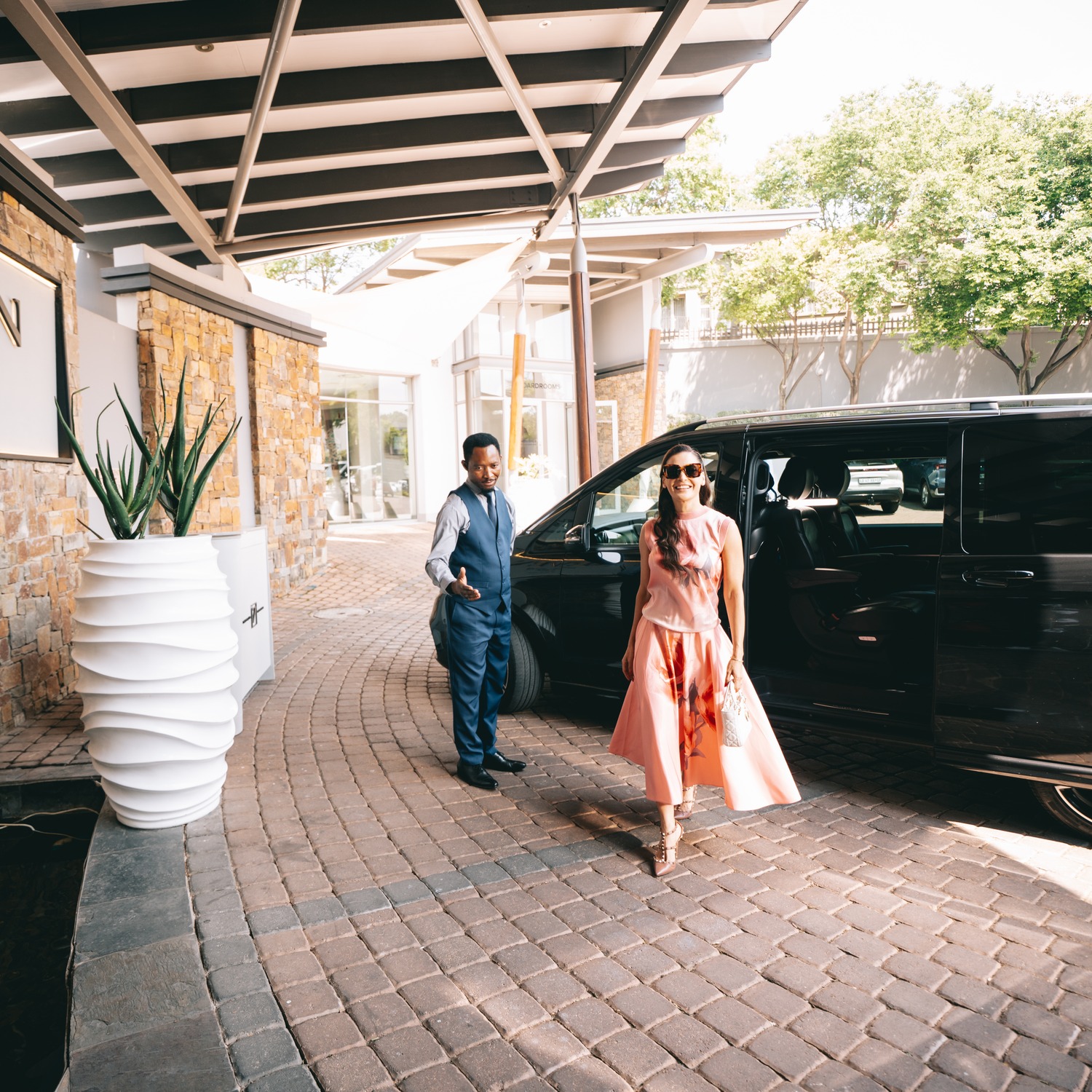 Guests arriving at the entrance to SEVEN Villa Hotel & Spa
