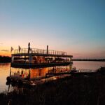 Yesterday, we spent two hours cruising the mighty Zambesi River with this stunner from @radissonblulivingstone 

The cruise includes unlimited drinks and snacks and the most beautiful sunsets with palm-tree lined horizons. 

We even spotted some hippos.

It certainly was the perfect end to an adventurous day.

#travel #traveladdict #zambia #zambesiriver #cruise